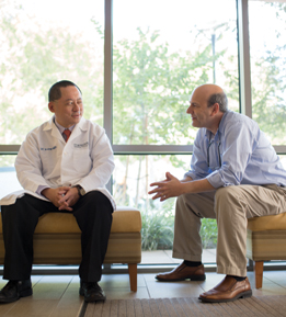 Dr. Sai-Hong Ignatius Ou talks with lung cancer patient Dr. Allen Freemont 