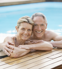older man and woman in pool