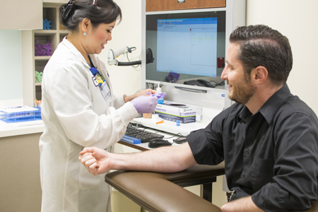 man getting lab test during physical