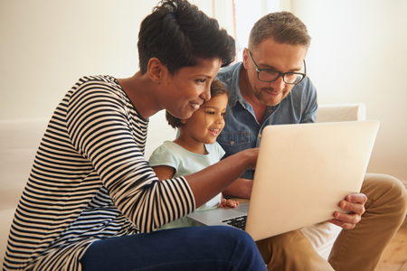couple researching their open enrollment options