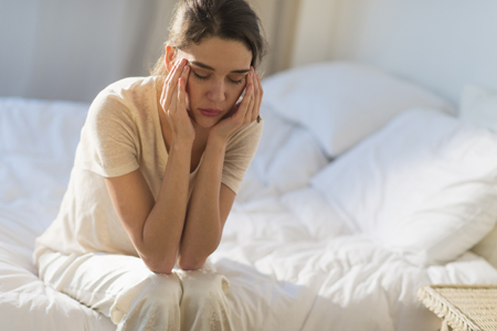 woman with a migraine headache