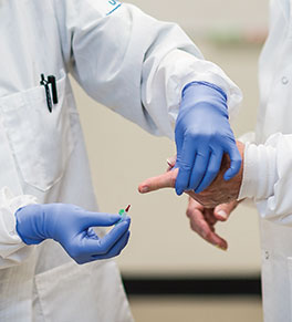 A simple prick of the finger is how blood is collected to test for antibodies to the novel coronavirus by UCI virology expert Philip Felgner's team.