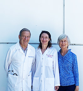 UCI Health dermatologist Dr. Kristen Kelly is flanked by her heroes: father and dean emeritus of the UCI School of Medicine, Thomas Cesario, and mother, occupational therapist Mary Cesario.