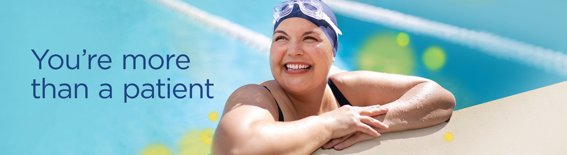 smiling woman relaxing with folded arms at pool edge