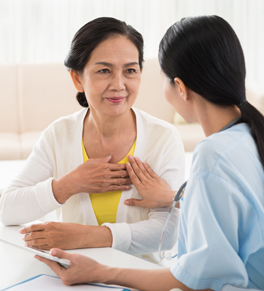 asian woman with hereditary heart attack risk visiting nurse