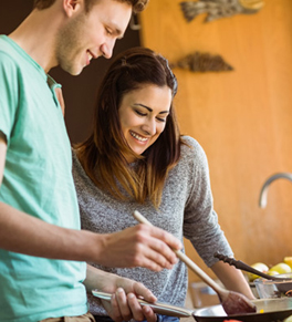 young couple cooking healthy for stronger hearts