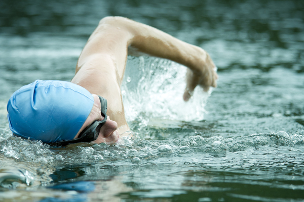 man swimming for arthritis relief