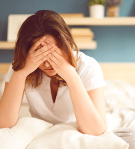 woman with a headache after daylight savings begins