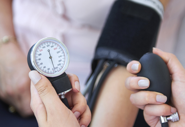 person blood pressure checked before taking decongestant for allergies