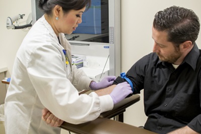 man getting blood taken for lab test