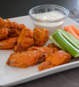 baked chicken wings with celery, carrots and blue cheese