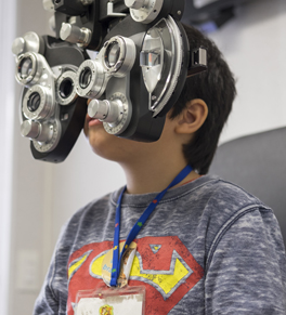 young boy having vision tested