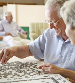 man with parkinson's disease playing puzzle