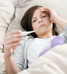 woman in bed with flu