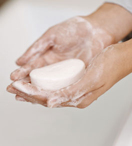 woman holding soap in hands