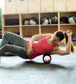 woman using foam roller after workout