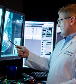 uci health radiologist freddie combs reviewing breast scans