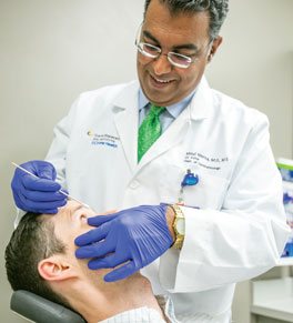 uci health ophthalmologist dr mitul mehta with patient
