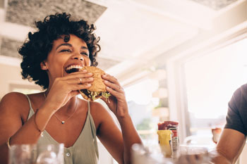 woman eating a burger