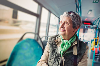 aging woman riding the bus