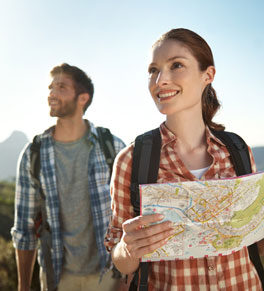 couple hiking with a map