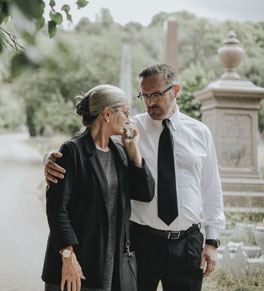 man comforting distraught woman