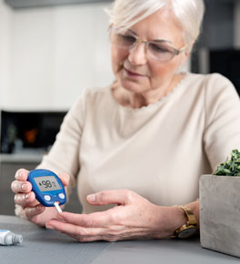woman with diabetes checking her blood glucose levels