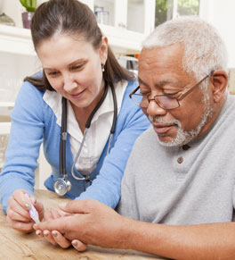 nurse showing man how to do insulin injections
