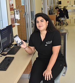 Neurocritical care fellow Dr. Sahar Osman helps families stay connected to hospitalized patients at UCI Medical Center during the COVID-19 outbreak.