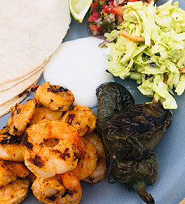 Grilled shrimp tacos with avocado slaw