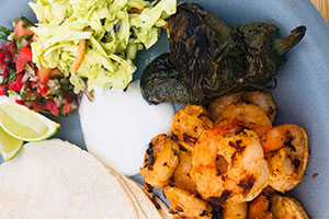 Grilled shrimp tacos with avocado slaw