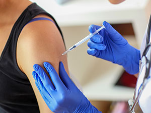 Doctor administers a vaccine shot