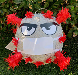 UCI Health family medicine practitioner Dr. Jose Mayorga and his family plan to celebrate Halloween by swatting this coronavirus pinata.