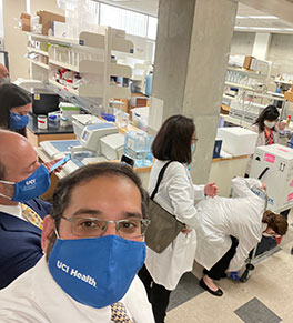 Dr. Cyrus Dastur, director of neurocritical care at UCI Health, watches the delivery of the first shipment of COVID-19 vaccines to UCI Medical Center.  