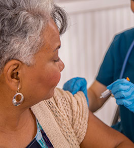 Woman receives a vaccination shot