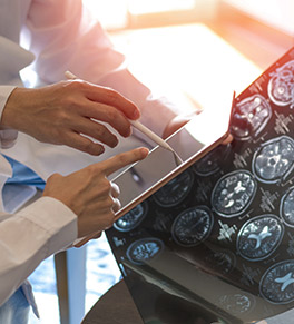 Doctors examine a patient's brain scans.