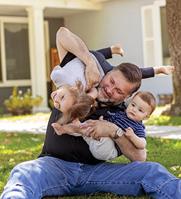 Scott Shuster, 55, is able to tumble with his grandchildren again thanks to hip replacement surgery at UCI Health.