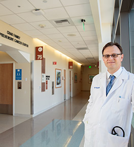 Dr. Stefan O. Ciurea, director of the UCI Health Hematopoietic Stem Cell Transplantation and Cellular Therapy Program, stands in the corridor outside the bone marrow transplant wing of UCI Douglas Hospital.