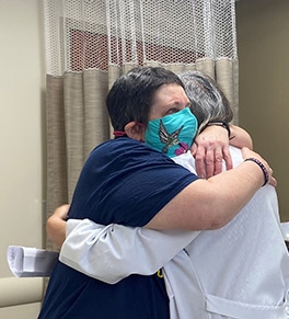 Two-time breast cancer survivor LeeAnn Brill embraces her UCI Health oncologist, Dr. Rita Mehta.