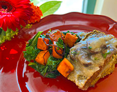 Savory Thanksgiving lentil loaf is topped with a creamy mushroom gravy.