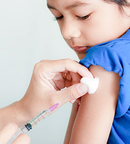 A young child gets a vaccination.