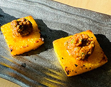 Polenta squares with sun-dried tomato and walnut tapenade