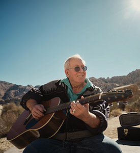 Alan Powell is able to enjoy playing his vintage guitar again after surgery to eliminate his epileptic seizures.