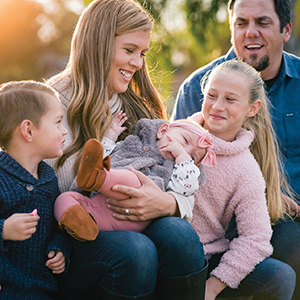 Ovarian cancer survivor Tatum Miller and her partner enjoy an afternoon at the park with their children.