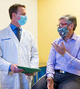 UCI Health bariatric surgeon Dr. Brian R. Smith checks in with vertical sleeve gastrectomy patient Michael Feldman.