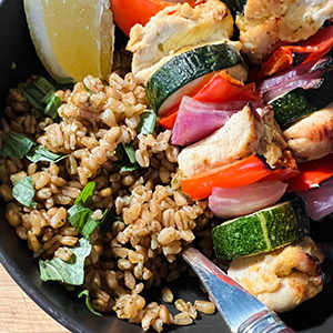 Sicilian chicken and vegetable skewers with pesto farro 