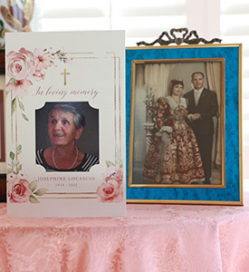 Domenica LoCascio keeps her late mother's memorial mass program alongside a photo of her mother and father in traditional Sicilian wedding garb.  