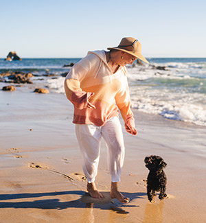 Jessica Reinhardt runs on the beach with her beloved dog Henry for the first time since her treatment for MS.