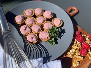 Berries and yogurt in a bite-sized walnut crust