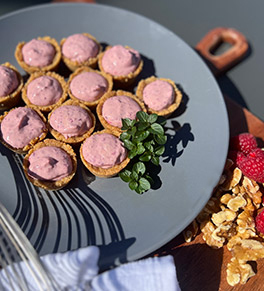 Berries and yogurt in a bite-sized walnut crust